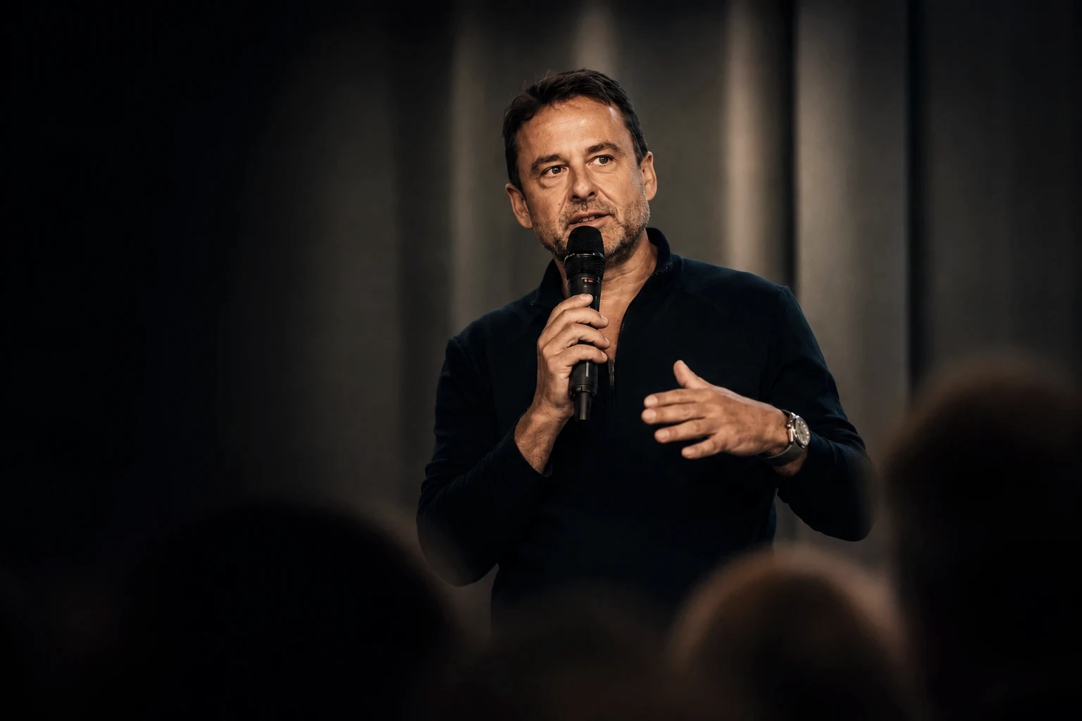 Frank Gessner speaking on stage