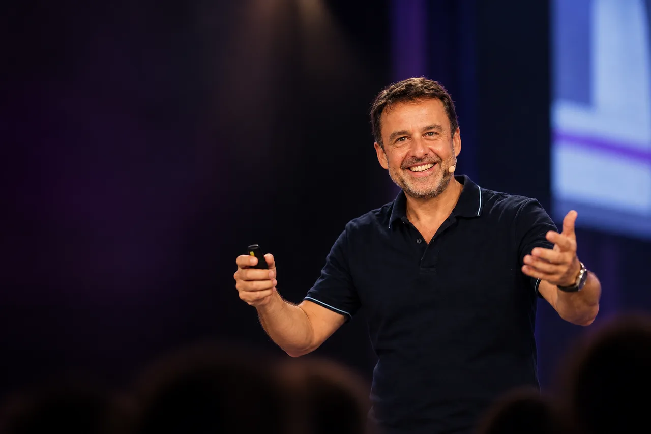 Frank Gessner speaking on stage